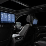 White Cadillac Escalade 600 in Luxe AF Motors Warehouse in Houston, Texas
