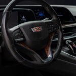White Cadillac Escalade 600 in Luxe AF Motors Warehouse in Houston, Texas