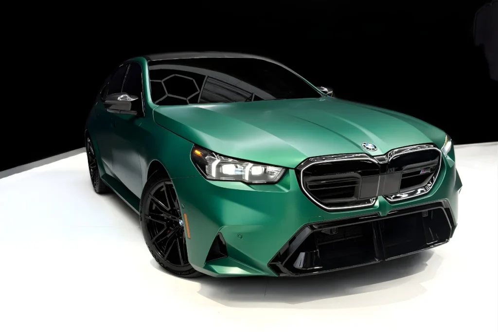 Green BMW M5 in Luxe AF Motors Warehouse in Houston, Texas