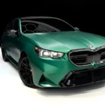 Green BMW M5 in Luxe AF Motors Warehouse in Houston, Texas