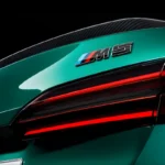 Green BMW M5 in Luxe AF Motors Warehouse in Houston, Texas