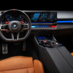 Green BMW M5 in Luxe AF Motors Warehouse in Houston, Texas