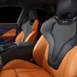 Green BMW M5 in Luxe AF Motors Warehouse in Houston, Texas