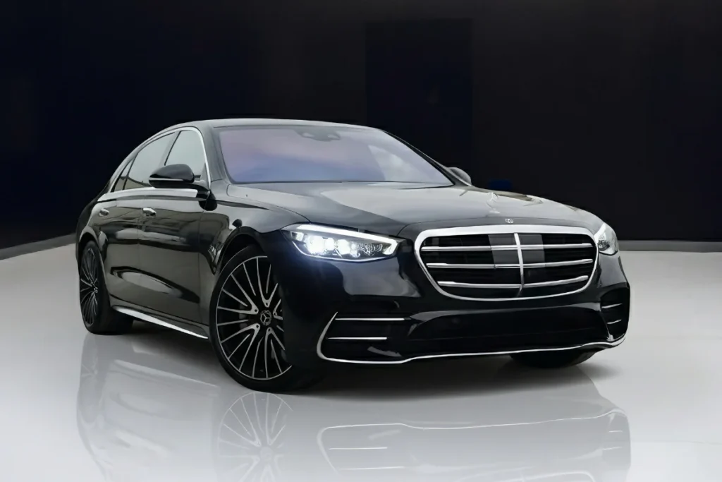 A black Mercedes-Benz S580 AMG luxury sedan parked outdoors, showcasing its elegant and powerful appearance.