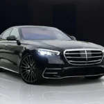 A black Mercedes-Benz S580 AMG luxury sedan parked outdoors, showcasing its elegant and powerful appearance.