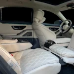 A black Mercedes-Benz S580 AMG luxury sedan parked outdoors, showcasing its elegant and powerful appearance.