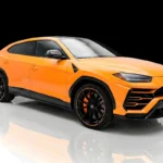 Orange Lamborghini Urus Pearl Capsule rental Houston front side view