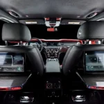 Rolls Royce Cullinan rear theater configuration with picnic tables and screens