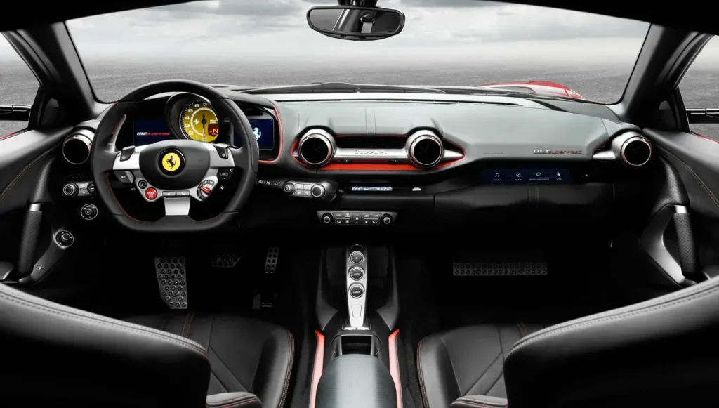 Driver-focused interior of a Ferrari 812 Superfast featuring a leather-wrapped steering wheel, digital instrument cluster, carbon fiber accents, and premium sport cockpit.